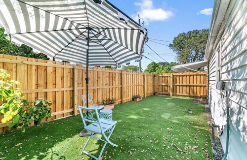 Mango Groves House | Steps from the Ocean - Pet Friendly Two Bed One Bath Beach Cottage