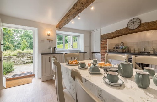 Ebbesborne Wake Cottage | This beautiful 300-year-old detached thatched cottage nestled within the stunning Cranborne Chase.