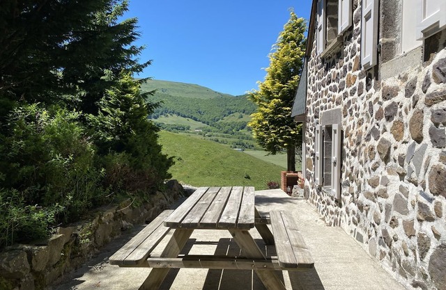 Farmhouse on the mountain overlooking the valley.