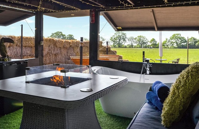 We just love the outside entertainment area with a bath for two, table top fire pit and large Smart