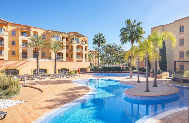 Luxury apartment in Vilamoura with a gym and interior and exterior pool
