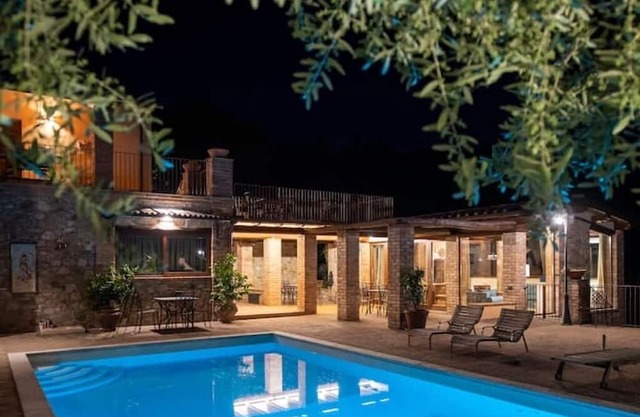 In the charming Umbrian countryside near Orvieto, villa with pool and waterfall.