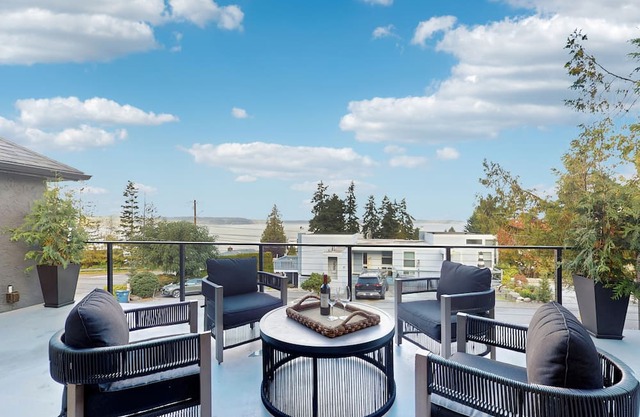 Modern retreat with panoramic ocean views, chef’s kitchen, and gas fireplace