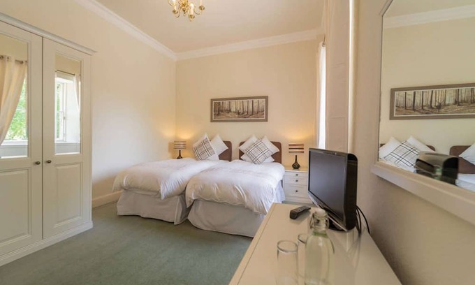 Livingston Cabin | This spacious twin room, located on the first floor, boasts relaxing neutral decor,