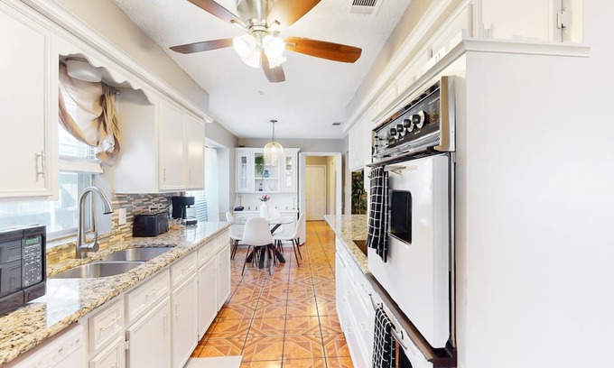 Richardson House | Private home with enclosed backyard, gas grill, sunny interior, & smart TVs