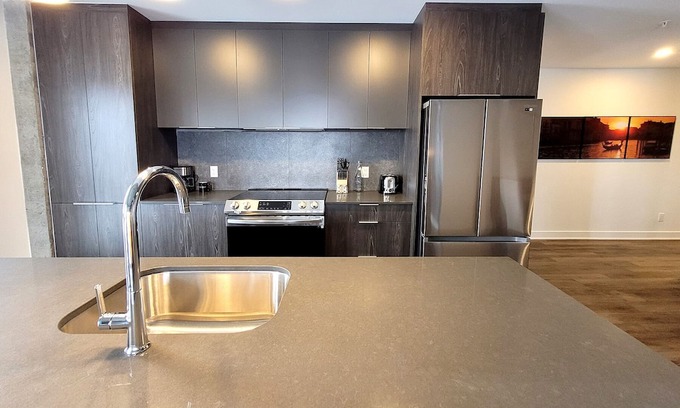 Fabreville Apartment | Corporate Stays - Elegant 3BR with Rooftop, Gym & Lounge