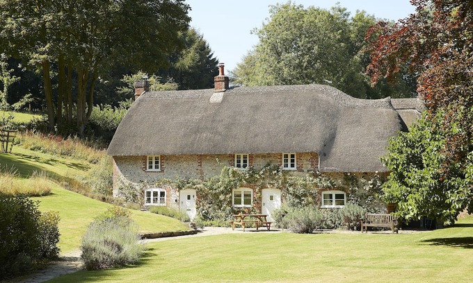 Ebbesborne Wake Cottage | This beautiful 300-year-old detached thatched cottage nestled within the stunning Cranborne Chase.